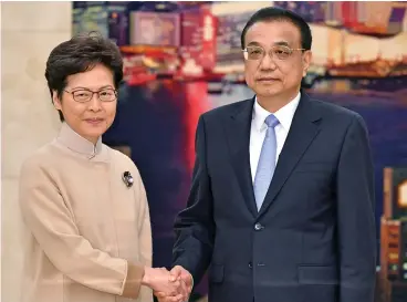  ?? (AFP) ?? Chinese Premier Li Keqiang (right) with Hong Kong Chief Executive Carrie Lam in Beijing on Monday