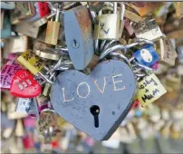 ?? Reuters ?? Thousands of padlocks clipped by lovers are seen on the fence of the Pont des Arts in Paris. —