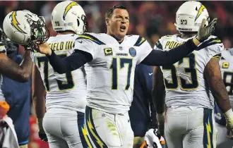  ?? PETER AIKEN/GETTY IMAGES ?? Chargers quarterbac­k Philip Rivers rallied his team from a 14-point hole to beat the Chiefs on Thursday. It’s the 11th time he’s helped his team overcome such a deficit, the most of any active QB.