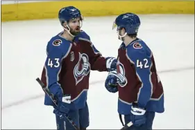  ?? AARON ONTIVEROZ — THE DENVER POST ?? Darren Helm (43) of the Avalanche and Josh Manson (42) speak during the second period of Game 5of the Stanley Cup Finals against the Lightning at Ball Arena in Denver on Friday, June 24, 2022.
