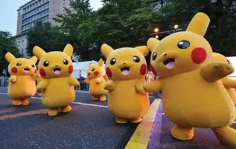  ?? KAZUHIRO NOGI/AFP/GETTY IMAGES FILE PHOTO ?? Pokemon GO is a smartphone app that players can use to catch, trade and stage battles between the creatures.