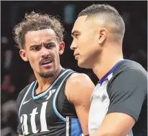  ?? MIKE STEWART / ASSOCIATED PRESS ?? Atlanta Hawks guard Trae Young speaks to an official during Saturday’s game against the Memphis Grizzlies in Atlanta.