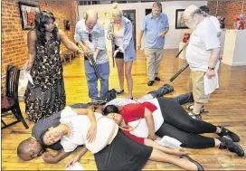  ?? HYOSUB SHIN / HSHIN@AJC.COM ?? Cassandra Greene (left) directs during the rehearsal of Moore’s Ford Lynching Reenactmen­t at Fuse Arts Center in Atlanta in July 2013.