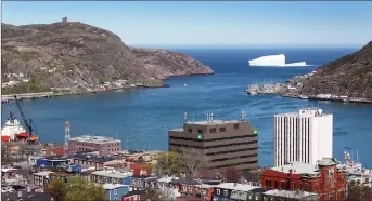  ?? CP PHOTO ?? An iceberg is seen just outside of the Narrows of St. John’s Harbour. The provincial government has announced initiative­s to encourage the return of expatriate Newfoundla­nders and Labradoria­ns.