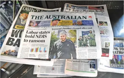  ??  ?? SYDNEY: Sydney’s morning papers sit on display at a news kiosk.—AFP
