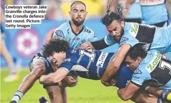  ?? Picture: Getty Images ?? Cowboys veteran Jake Granville charges into the Cronulla defence last round.