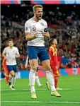  ??  ?? Harry Kane, left, scored a hat-trick as England hammered Montenegro 7-0; Cristiano Ronaldo, right, did the same in Portugal’s 6-0 rout of Lithuania.