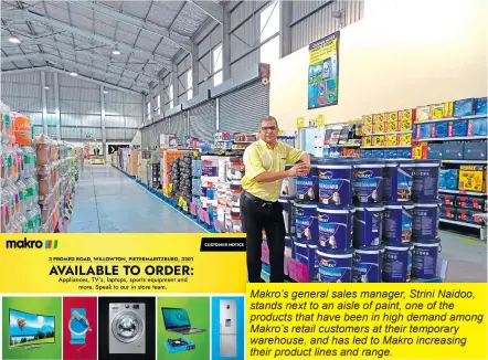  ?? ?? Makro’s general sales manager, Strini Naidoo, stands next to an aisle of paint, one of the products that have been in high demand among Makro’s retail customers at their temporary warehouse, and has led to Makro increasing their product lines and range.