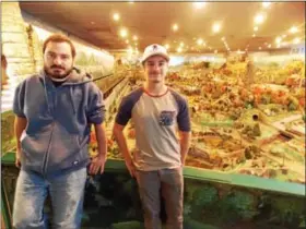  ?? LISA MITCHELL - DIGITAL FIRST MEDIA ?? Manager Brian Hilbert and Village supervisor Jon Jordan of Hamburg want to protect Laurence Gieringer’s legacy of miniature villages spanning 200years in time and roughly 6,000square feet in size at Roadside America in Shartlesvi­lle.