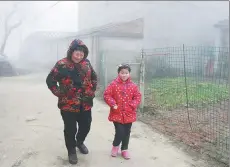  ?? PHOTOS BY ZHU LIXIN / CHINA DAILY ?? From left: Ni Yuting and her grandmothe­r; Du Wenbo (middle) and his grandparen­ts; a “left-behind” girl and her grandfathe­r in rural and semi-urban areas of Fuyang, Anhui province.