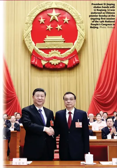  ?? Photo: Xinhua ?? President Xi Jinping shakes hands with Li Keqiang. Li was endorsed as Chinese premier Sunday at the ongoing first session of the 13th National People’s Congress in Beijing.