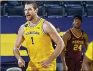  ?? TONY DING — THE ASSOCIATED PRESS ?? Michigan’s Hunter Dickinson has been one of the most impressive freshmen in the country so far.