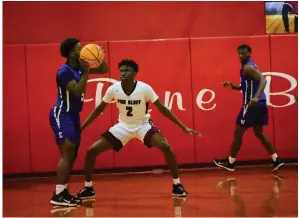  ?? (Pine Bluff Commercial/I.C. Murrell) ?? Pine Bluff senior guard Jalen Tatum (2) guards an El Dorado player Thursday in McFadden Gymnasium at Pine Bluff High School.