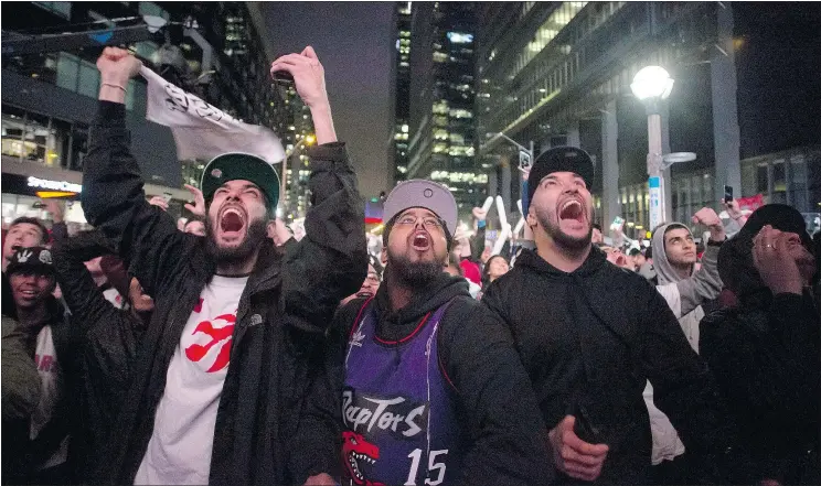  ?? — THE CANADIAN PRESS FILES ?? Raptors fans watch Game 7 of their first-round series against the Indiana Pacers Sunday, a game which attracted the Raptors’ largest TV audience ever.