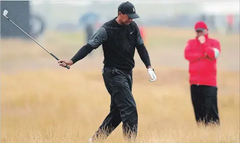  ?? JON SUPER THE ASSOCIATED PRESS ?? A traditiona­l rough at Carnoustie, Scotland, caused Tiger Woods and other players a few headaches at the British Open on Friday. Woods shot a 71 and remains in contention.