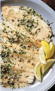  ?? [PHOTO BY CARL TREMBLAY, AMERICA’S TEST KITCHEN/AP] ?? Pan-fried sole with lemon-caper pan sauce appears in the cookbook “Just Add Sauce.”