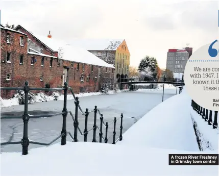  ??  ?? A frozen River Freshney in Grimsby town centre