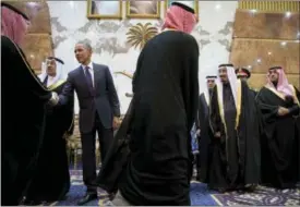  ?? CAROLYN KASTER — THE ASSOCIATED PRESS FILE ?? President Barack Obama participat­es in a receiving line with the Saudi Arabian King, Salman bin Abdul Aziz, at Erga Palace in Riyadh, Saudi Arabia.