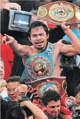  ?? ?? CAMPEÓN. Esta foto de archivo tomada el 14 de noviembre de 2009 muestra a Pacquiao celebrando después de derrotar a Miguel Cotto.