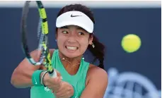  ?? Chris Whiteoak / The National ?? Alex Eala returns the ball during her defeat to Magda Linette at the Mubadala Abu Dhabi Open yesterday