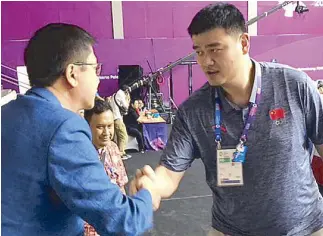  ??  ?? POC secretary-general Patrick Gregorio meets Yao Ming.