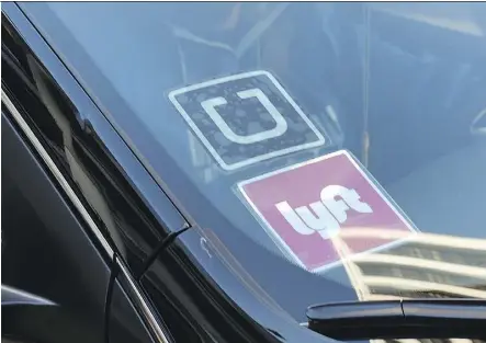  ?? RICHARD VOGEL/AP FILES ?? Competitio­n is heating up amid Uber’s struggles, with the imminent launch of Lyft in Toronto and the rollout of Facedrive last week. Several thousand drivers had indicated an interest and more than 50,000 people had downloaded the Lyft app ahead of its...