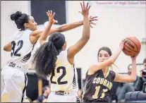  ?? ROBERTO E. ROSALES/JOURNAL ?? Volcano Vista’s Raven Herrera, left, and Deezha Battle, middle, apply pressure to Cibola’s Lexi Baca during their game Friday.