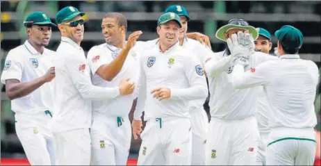  ?? AFP ?? Kagiso Rabada (extreme left) and Vernon Philander (third from left) shared five wickets as the Indian batsmen were exposed once again on Wednesday.