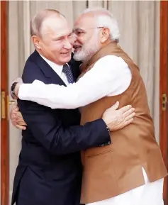  ?? — Reuters photo ?? Modi welcomes Putin prior to their meeting at Hyderabad House in New Delhi, India.