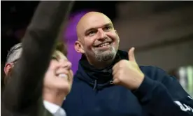  ?? ?? John Fetterman, Pennsylvan­ia’s lieutenant governor, takes a selfie with attendees at a meet-and-greet in May. Photograph: Hannah Beier/Reuters