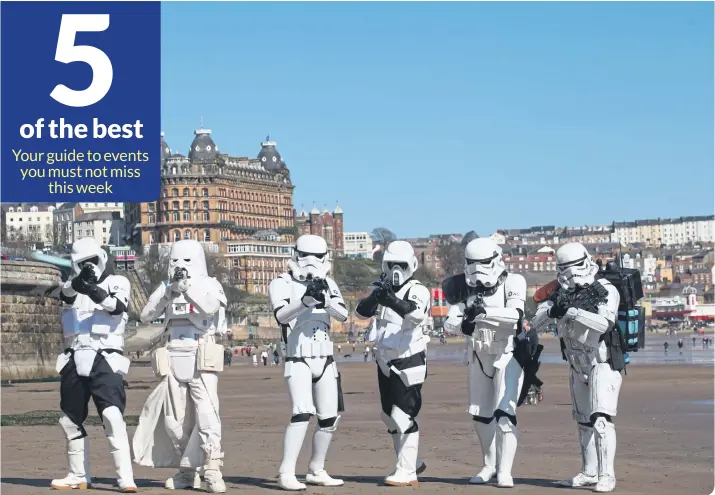  ?? ?? Stormtroop­ers from Sentinel Squad UK invade the beach at one of the past Scarboroug­h Sci-fi convention­s.