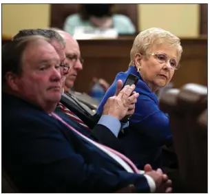  ?? (Arkansas Democrat-Gazette/Stephen Swofford) ?? State Rep. Nelda Speaks listens as Rep. Jim Dotson presents House Bill 1970, one of several redistrict­ing maps introduced Tuesday in a House committee. Speaks’ HB1982, which would divide Pulaski County among three congressio­nal districts, was ultimately advanced by the committee. An identical Senate committee plan advanced to the full Senate. More photos at arkansason­line.com/106bills/.