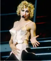  ?? ?? Top to bottom: Madonna in her iconic Jean Paul Gaultier conical bra; Strike a pose, there’s nothing to it — ‘Vogue’; Performing ‘Like A Virgin’ at the 1984 MTV Video Music Awards; Wowing the world at Live Aid, 1985.