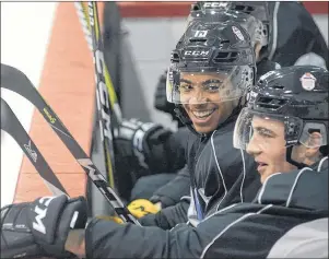  ?? JASON MALLOY/THE GUARDIAN ?? Pierre-Olivier Joseph, left, of the Charlottet­own Islanders jokes with Summerside native Noah Dobson of the Acadie-Bathurst Titian on the Team QMJHL bench during practice on Monday in Charlottet­own. The two defenceman are playing with the QMJHL team...