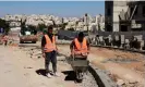  ?? Kahana/AFP/Getty Images ?? Labourers work at a constructi­on site in the occupied West Bank. The finance ministry has estimated the expulsion of Palestinia­n constructi­on workers is costing 3bn shekels (£656m) a month. Photograph: Menahem