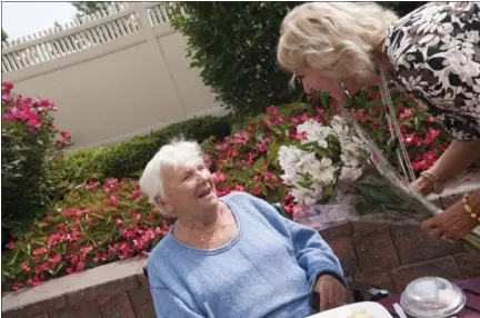  ?? SUBMITTED PHOTO ?? At last count, Patricia Gallagher, right, had collected and delivered more than 65,000bouquet­s over the years.