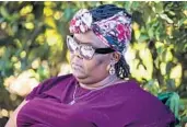  ?? PATRICK CONNOLLY/ORLANDO SENTINEL ?? Andrea Smith-Green, mother of Adrein Green, sits at a vigil where the teen was shot in Sanford on Tuesday.