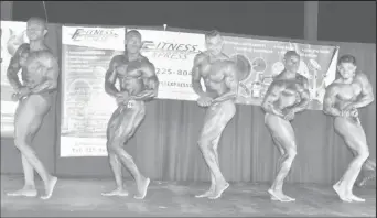  ??  ?? Kerwin Clarke (second from left), chiseled out his fifth Mr. Guyana Bodybuildi­ng championsh­ip performanc­e on Sunday night at Parc Rayne.