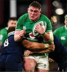  ??  ?? Tadhg Furlong is tackled by Jamie Ritchie and Hamish Watson.