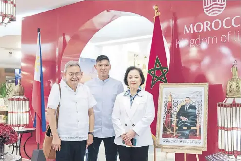  ?? ?? (FROM left) The author, Nedy’s son Michael and Nedy during the Morocco Kingdom of Light exhibition at Rustan’s Makati.