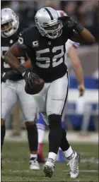  ??  ?? Oakland Raiders defensive end Khalil Mack celebrates after recovering a fumble during the second half of an NFL football game against the Buffalo Bills on Sunday in Oakland. AP PHOTO