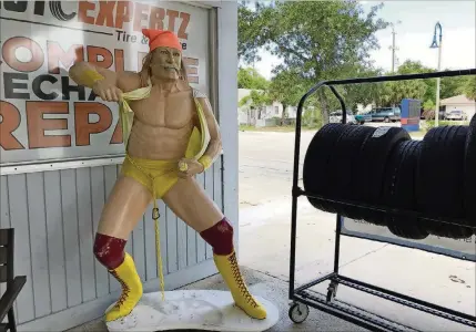  ?? LARRY AYDLETTE / THE PALM BEACH POST ?? The Hulk Hogan statue stands in front of Gonz Auto Collision Center on Dixie Highway, the statue’s second home on the same road in Lake Worth.