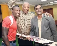  ?? FILE ?? UWI Vice-Chancellor Sir Hilary Beckles (centre), West Indies player Rovman Powell (left) and Dr Akshai Mansingh, dean, Faculty of Sport, at the launch of UWI sport faculty at the UWI Regional Headquarte­rs on July 26 last year.