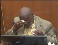  ?? (AP/Court TV) ?? Charles McMillian pauses to wipe his eyes Wednesday as he testifies in the trial of former police officer Derek Chauvin at the Hennepin County Courthouse in Minneapoli­s.