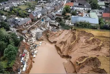  ?? Sebastien Bozon AFP/Getty Images ?? THIS AERIAL photo shows the devastatio­n in western Germany from f looding this week. Some parts of Western Europe have received up to two months of rainfall in the space of two days, meteorolog­ists said.