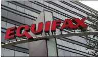  ?? THE CANADIAN PRESS/AP PHOTO/MIKE STEWART ?? This photo shows signage at the corporate headquarte­rs of Equifax Inc. in Atlanta. With Equifax among the latest in the increasing number of privacy class actions being launched in Canada, affected consumers looking to join such lawsuits may be...