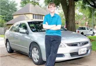  ?? Houston Chronicle via AP ?? RIGHT Parker Peddicord stands in front of his car on May 26 in Katy, Texas. The Safeway Driving school, a franchise with a location in Katy, offered training specific to people with special needs arising from conditions such as attention deficit...