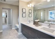  ??  ?? Highlighti­ng the master bedroom’s jaw-dropping ensuite: A stand-alone soaker tub and marble finishes.