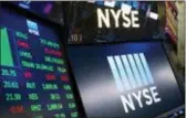  ?? MARK LENNIHAN — THE ASSOCIATED PRESS FILE ?? Stock screens are shown at the New York Stock Exchange. Energy companies and oil prices took their worst losses in months Friday on reports OPEC countries plan to produce more oil soon.
