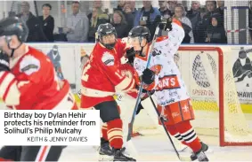  ??  ?? Birthday boy Dylan Hehir protects his netminder from Solihull’s Philip Mulcahy
KEITH & JENNY DAVIES